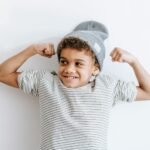 image of a boy showing his muscles