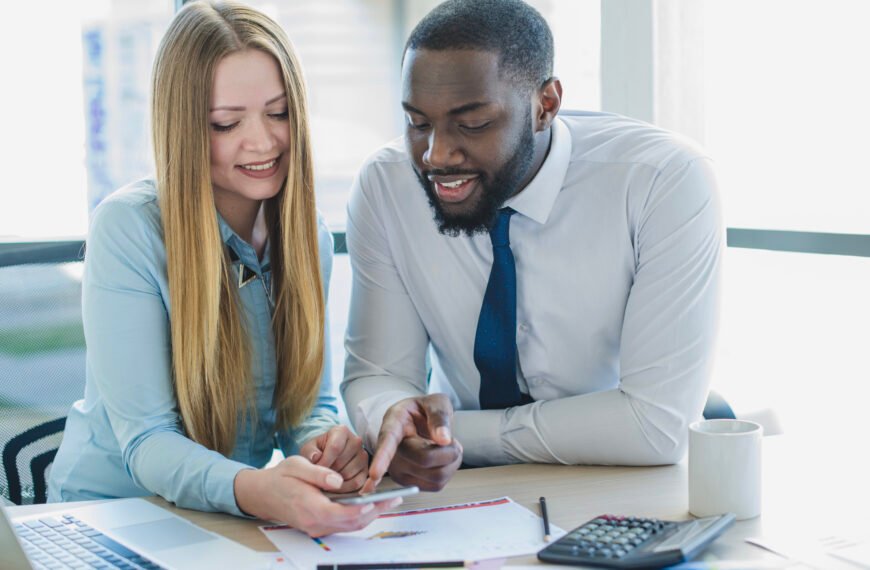 a male and female discussing financial items