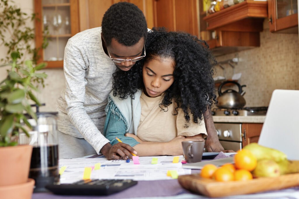 Man helping woman with financial planning