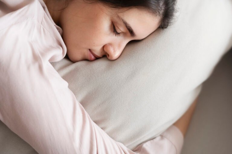 Woman sleeping comfortably on her pillow women sleeping on a pillow
