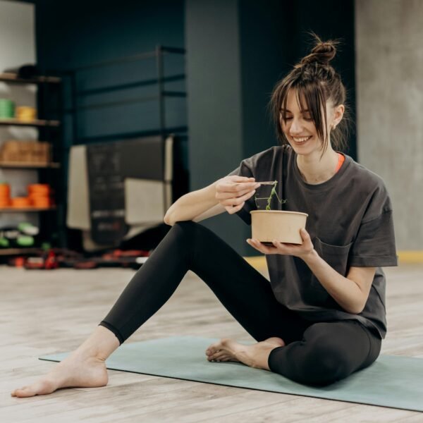 Woman eating a meal in the gym