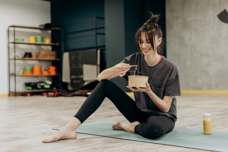 Woman eating a meal in the gym
