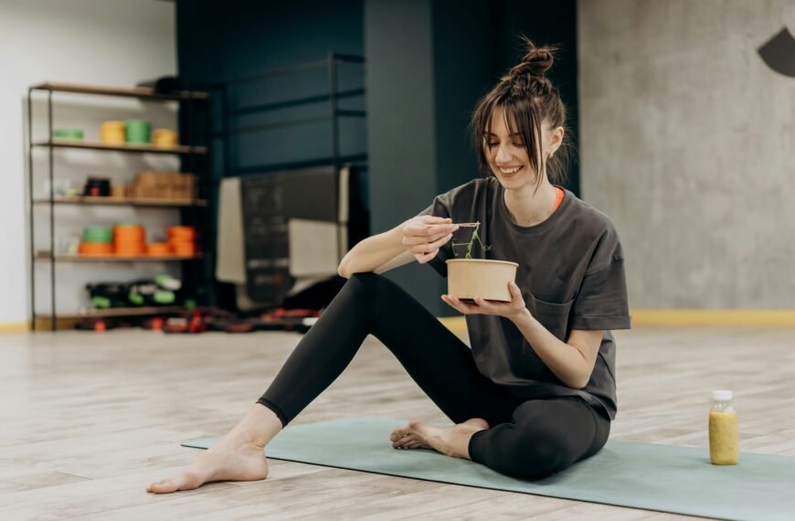 Woman eating a meal in the gym