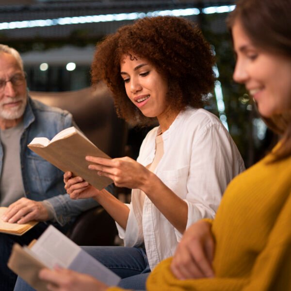 Women ready a story to others