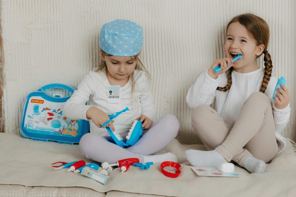 two kids playing with toy dentist tools
