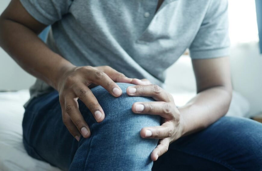 Man holding his knee due to joint pain