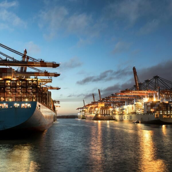 Images of cargo ship in a port at night