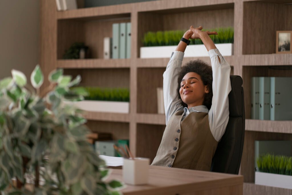 Stress free woman stretching in here office