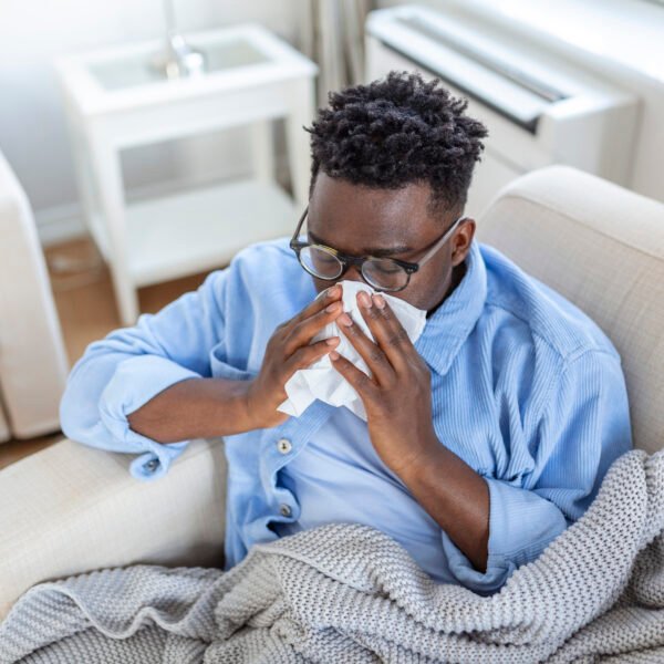 Sick man with the flu on his couch