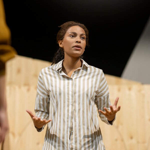 Confident woman speaking if front of other people