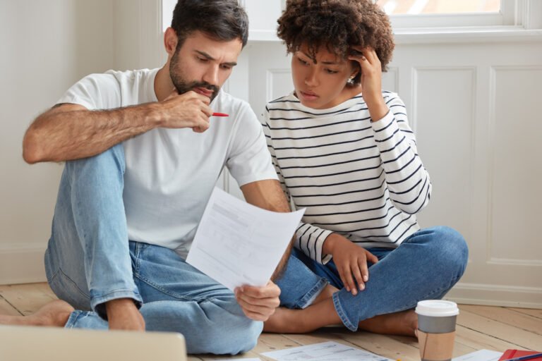 couple thinking about paying off their debt