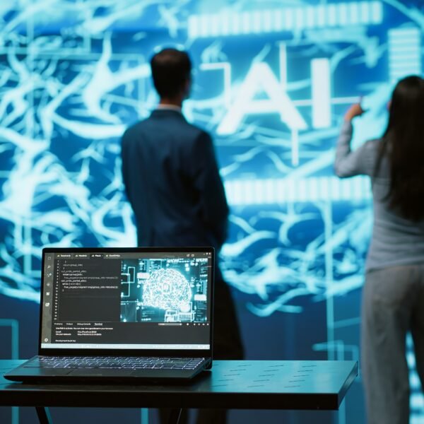 two people in futuristic office working alongside artificial intelligence