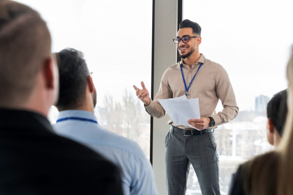 Man presenting to a group of business people