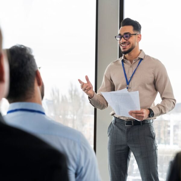 Man presenting to a group of business people