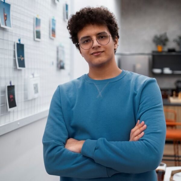 Young entrepreneur in front of a board with different images