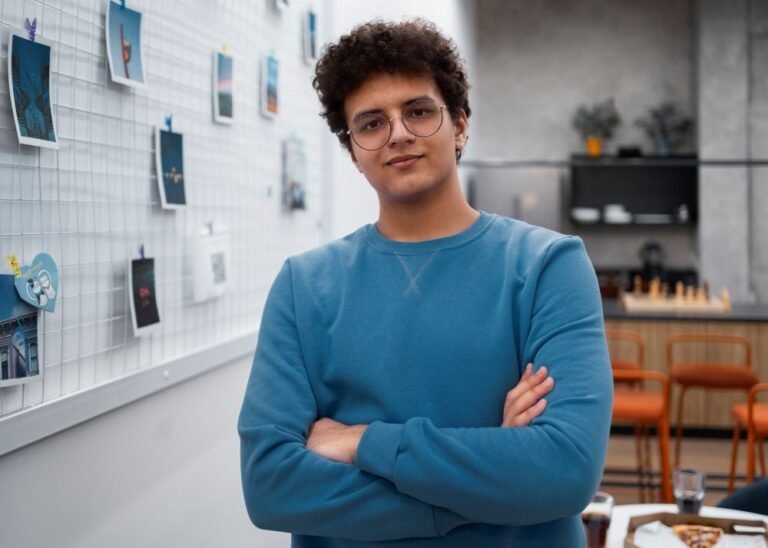 Young entrepreneur in front of a board with different images