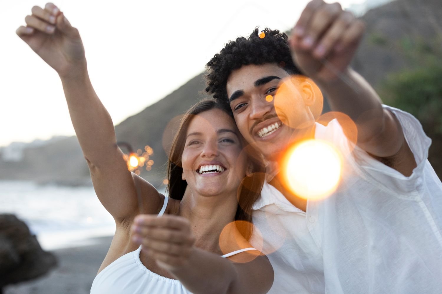 A happy man and a woman on the beach