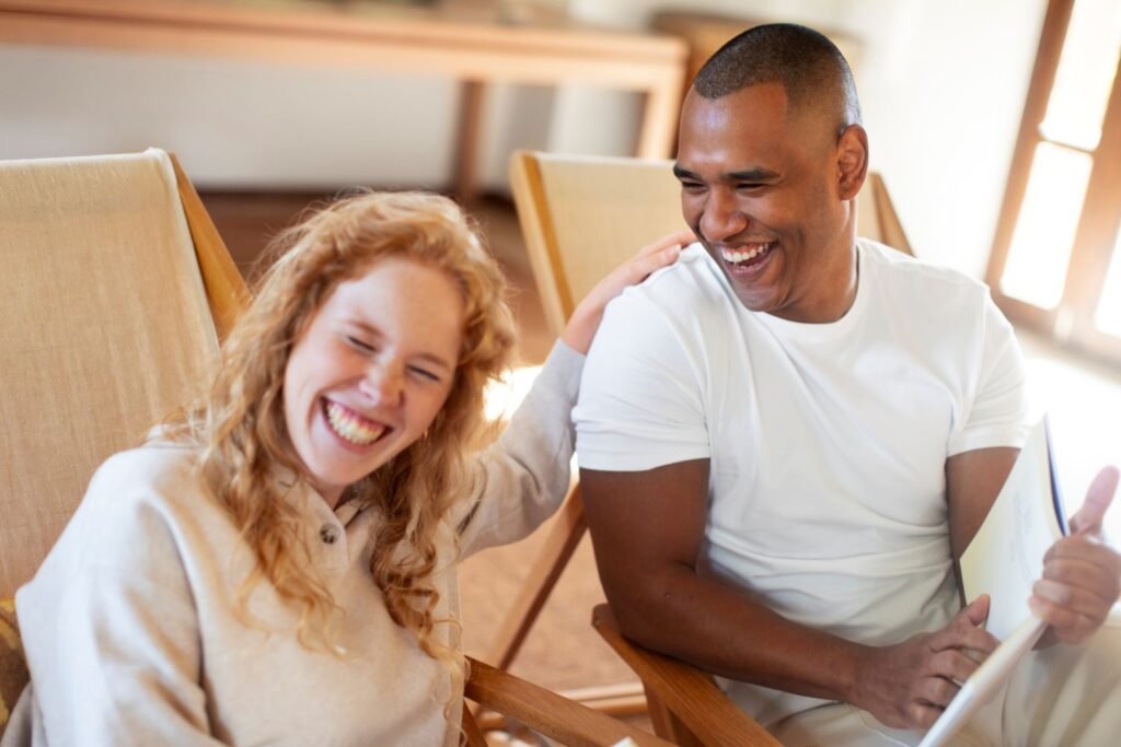 Two people laughing together — illustrating what makes a good life according to Harvard's 86-year happiness study