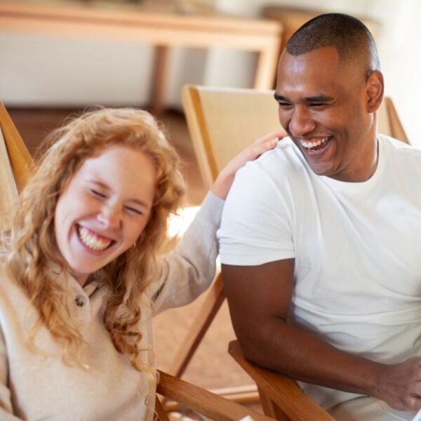 Two people laughing together — illustrating what makes a good life according to Harvard's 86-year happiness study