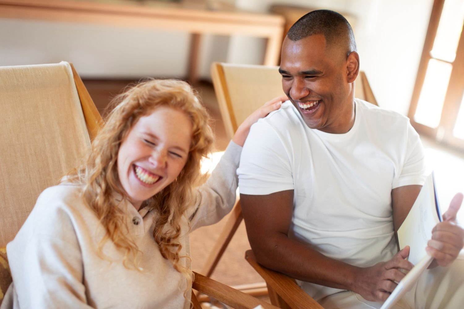 Two people laughing together — illustrating what makes a good life according to Harvard's 86-year happiness study